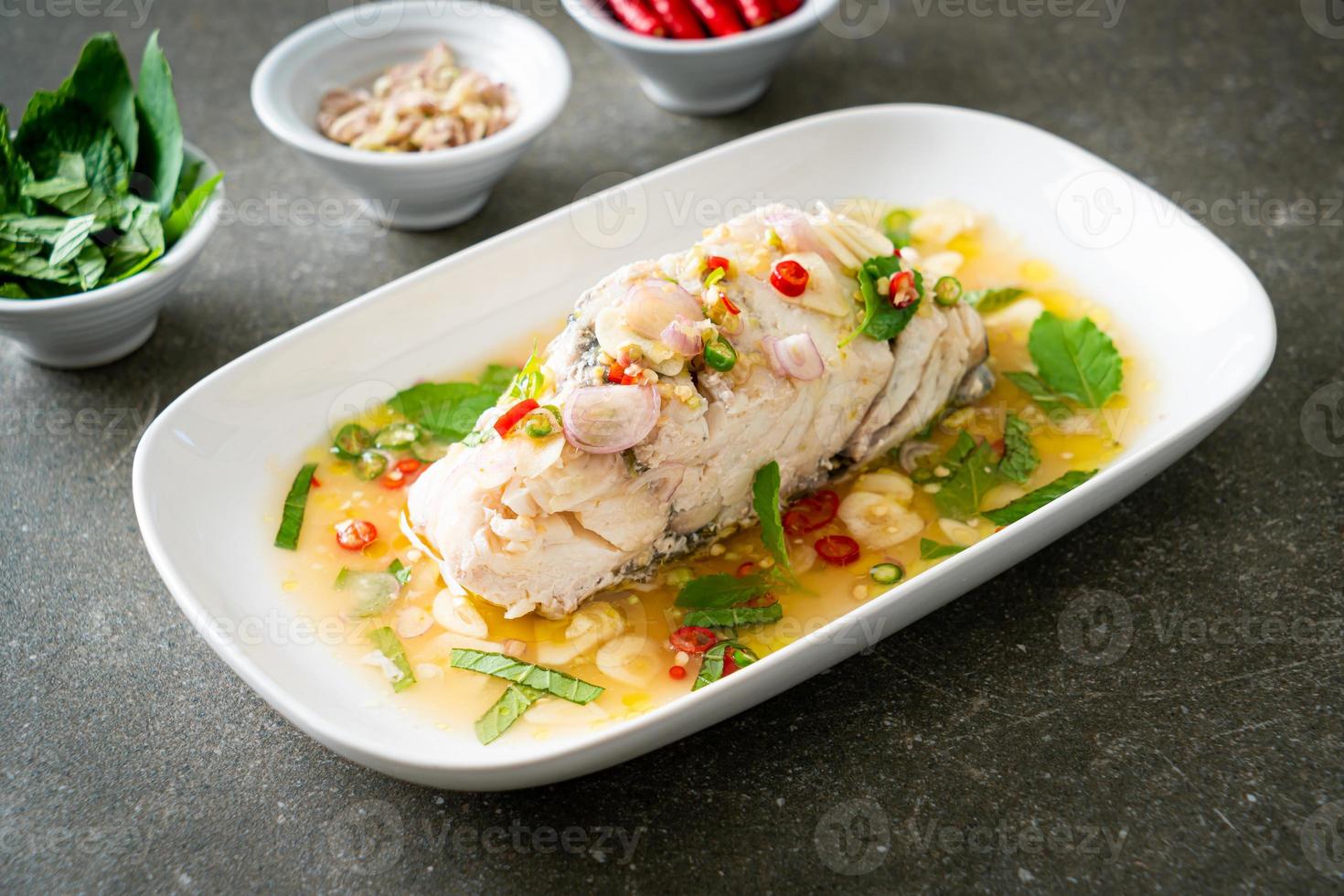 steamed sea bass fish with herbs 9724897 Stock Photo at Vecteezy