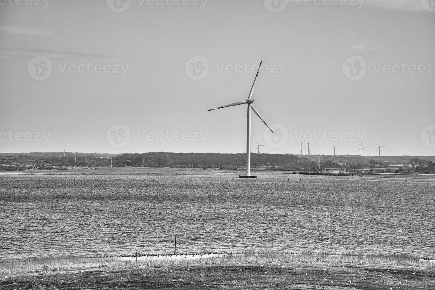 offshore wind turbine in black white. Green energy of the future. Renewable power supply photo