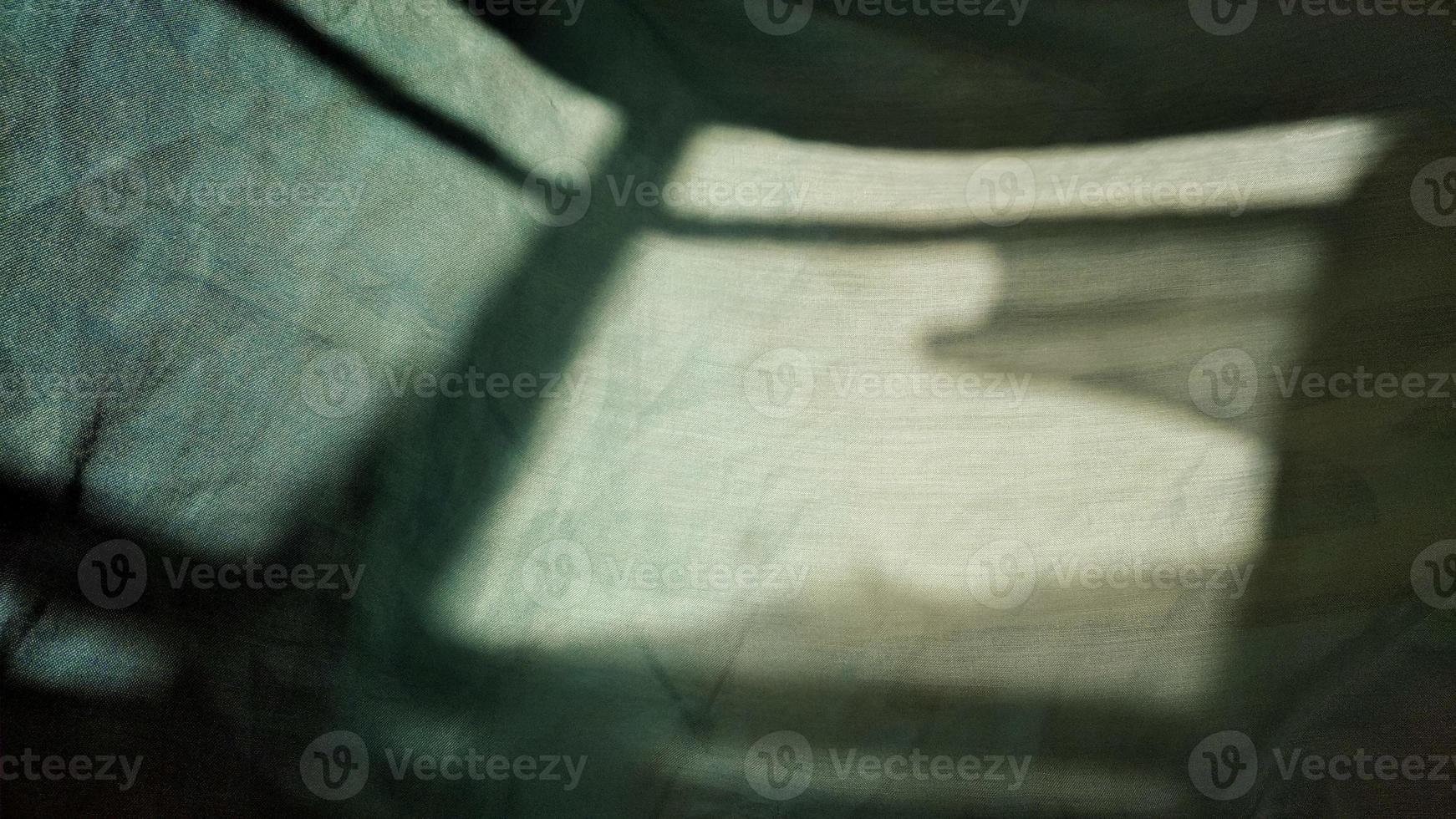 shadow of a Window on a piece of cloth. Light and shade. photo