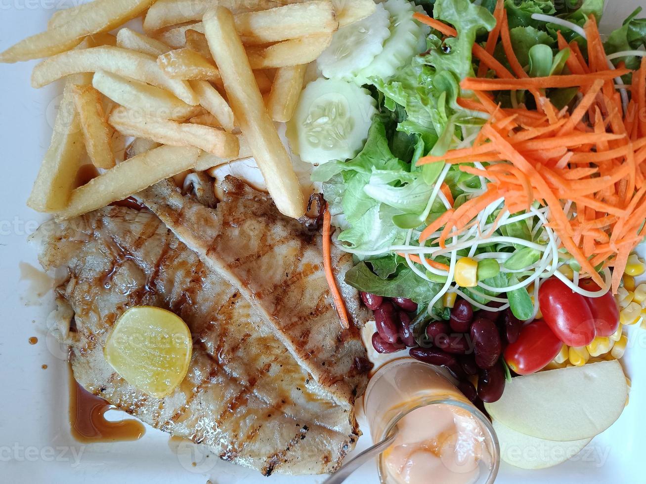 Top view Dolly Fish Steak, Grill fish in with dish for diet and clean menu photo