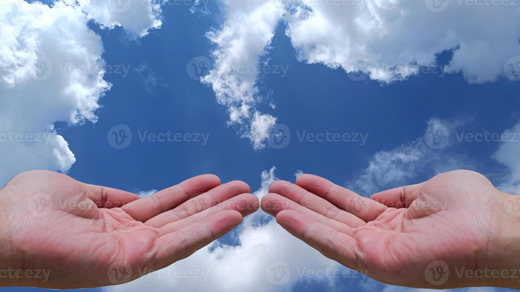 beautiful two hand open. sky and cloud background with clipping path. photo