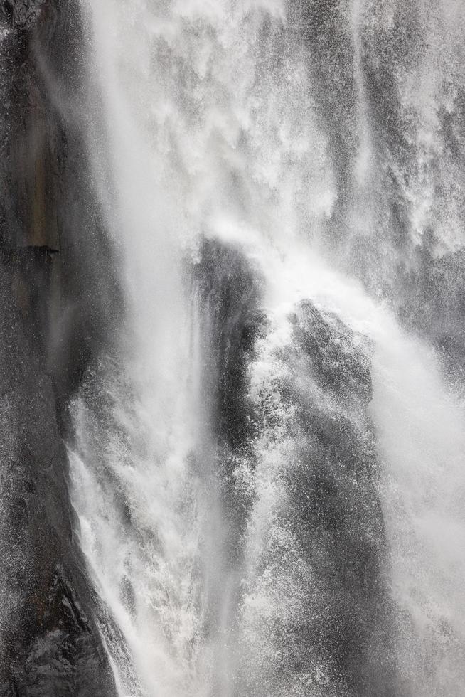 A natural waterfall in a big forest in the midst of beautiful nature. photo