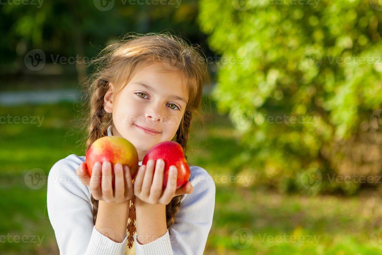 Little girl with apples 9731720 Stock Photo at Vecteezy