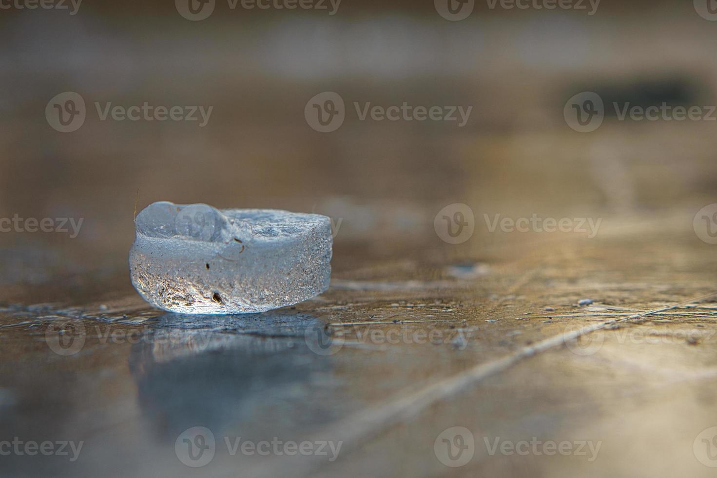 Ice pieces on a lake at sunset in winter atmosphere photo