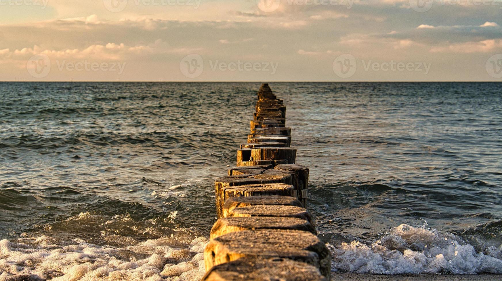 the Baltic Sea through the sea to the horizon at sunset. Romantic mood photo