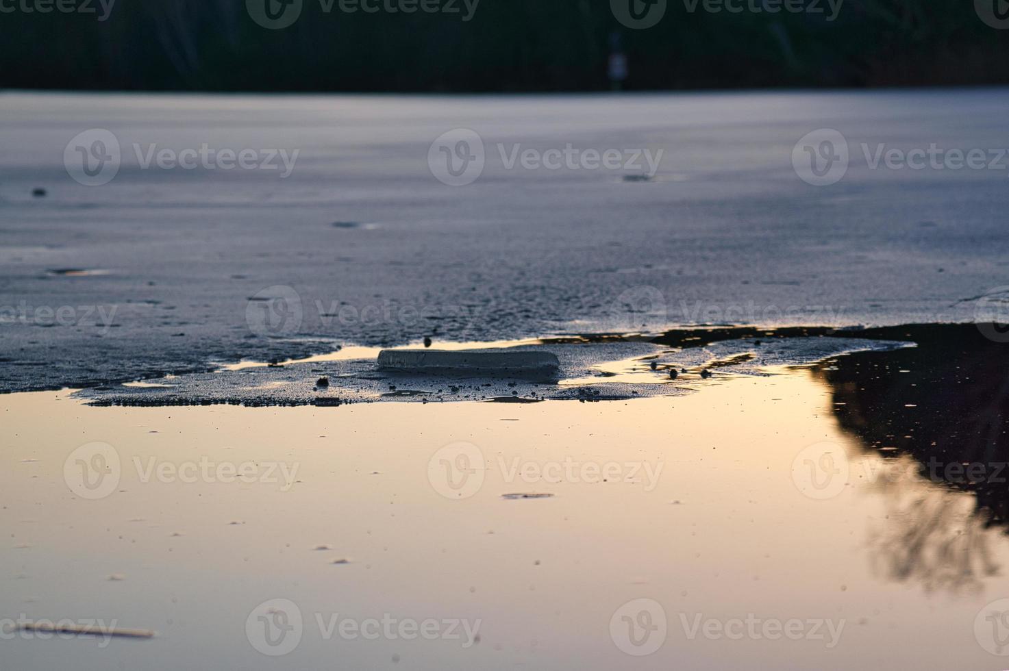 Ice edge on a lake at sunset. photo