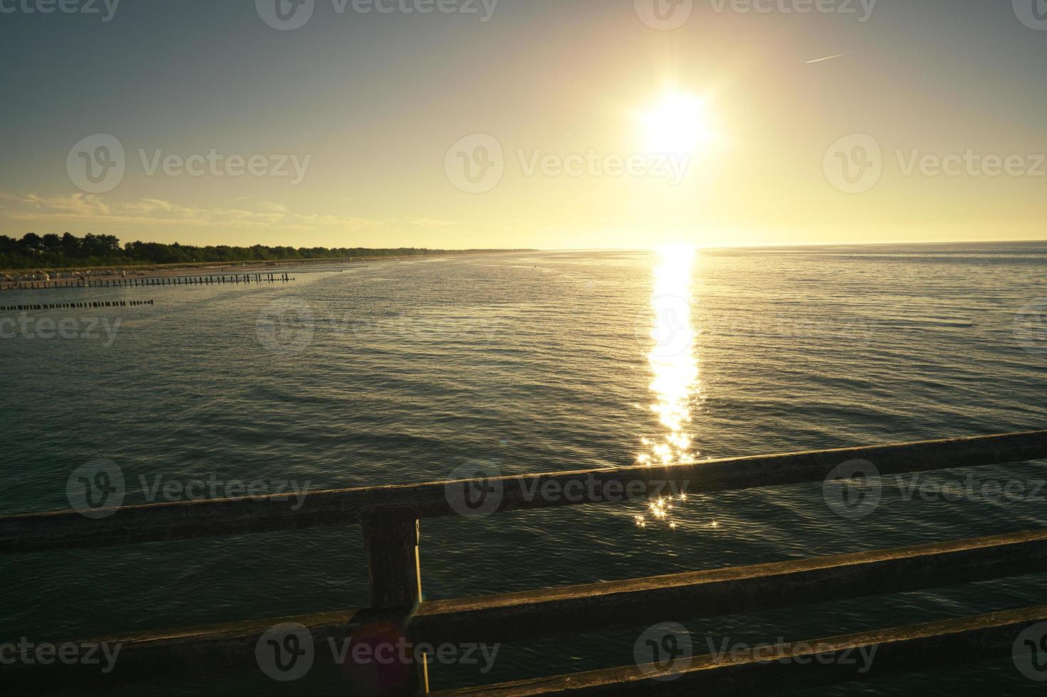 sunset on the beach of zingst at the baltic sea photo