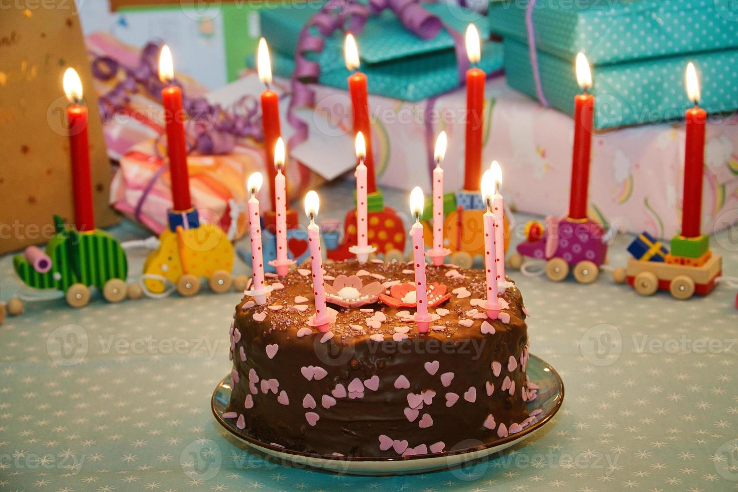 Birthday cake for the anniversary. Candles on the cake. Chocolate cake to celebrate photo