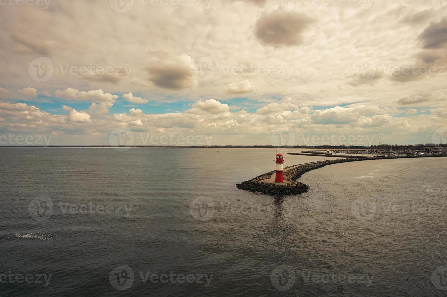 Lighthouse at Rostock harbor during departure by ship to Scandinavia photo