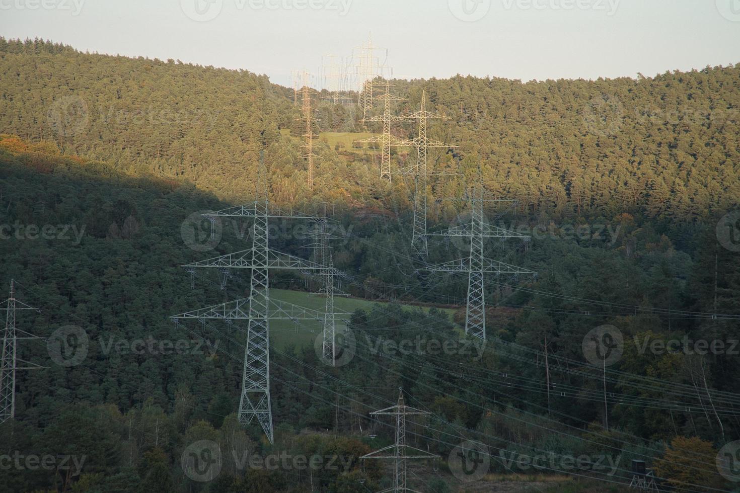 High voltage overhead power lines distributed across the country photo