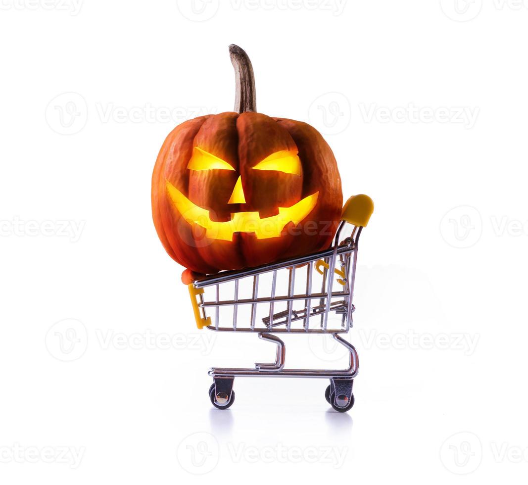 Halloween pumpkins in shopping cart isolated on white background photo
