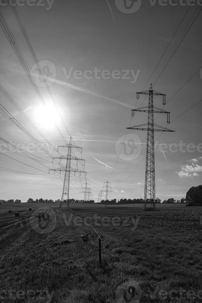 High voltage overhead power lines distributed across the country photo