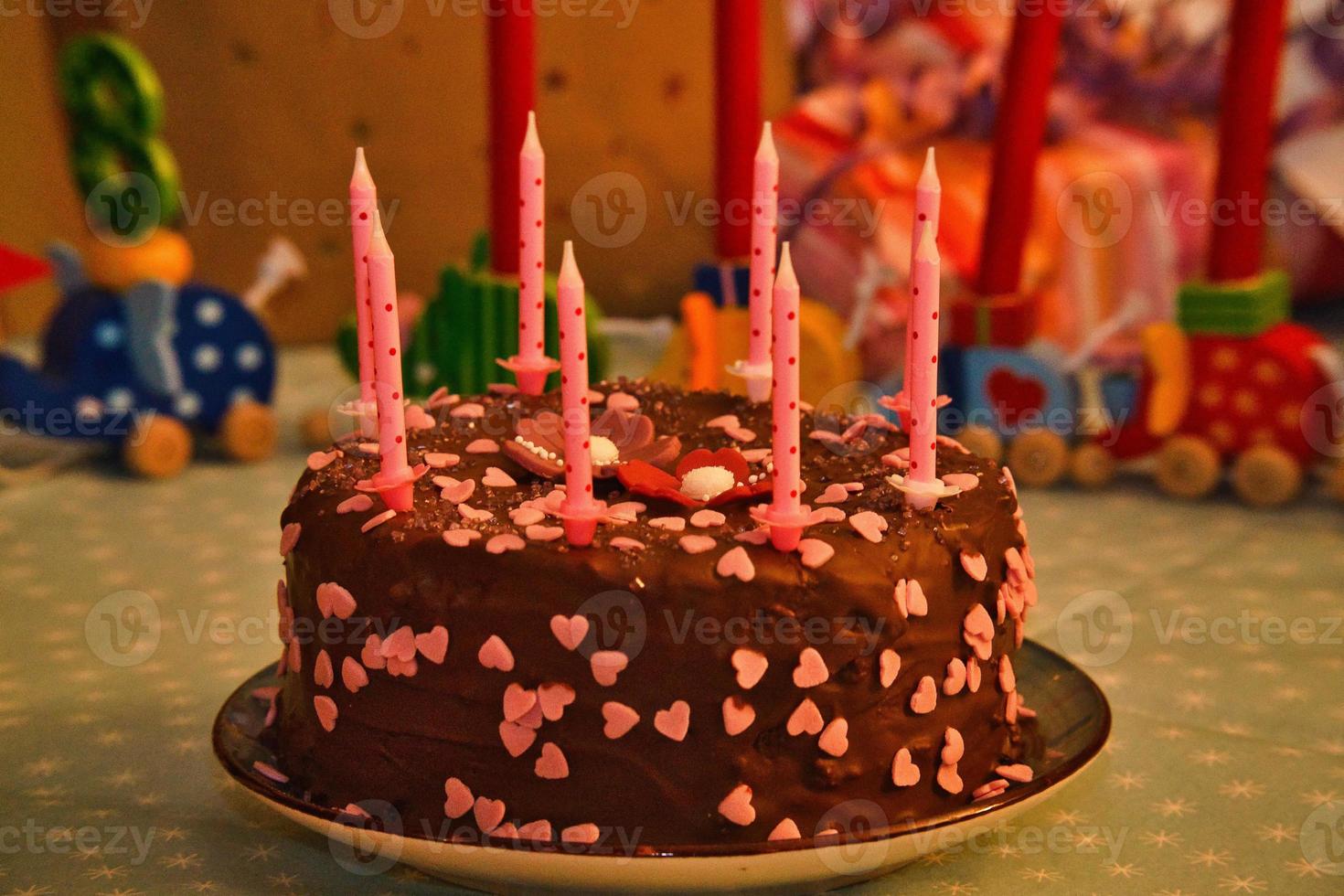 Birthday cake for the anniversary. Candles on the cake. Chocolate cake to celebrate photo
