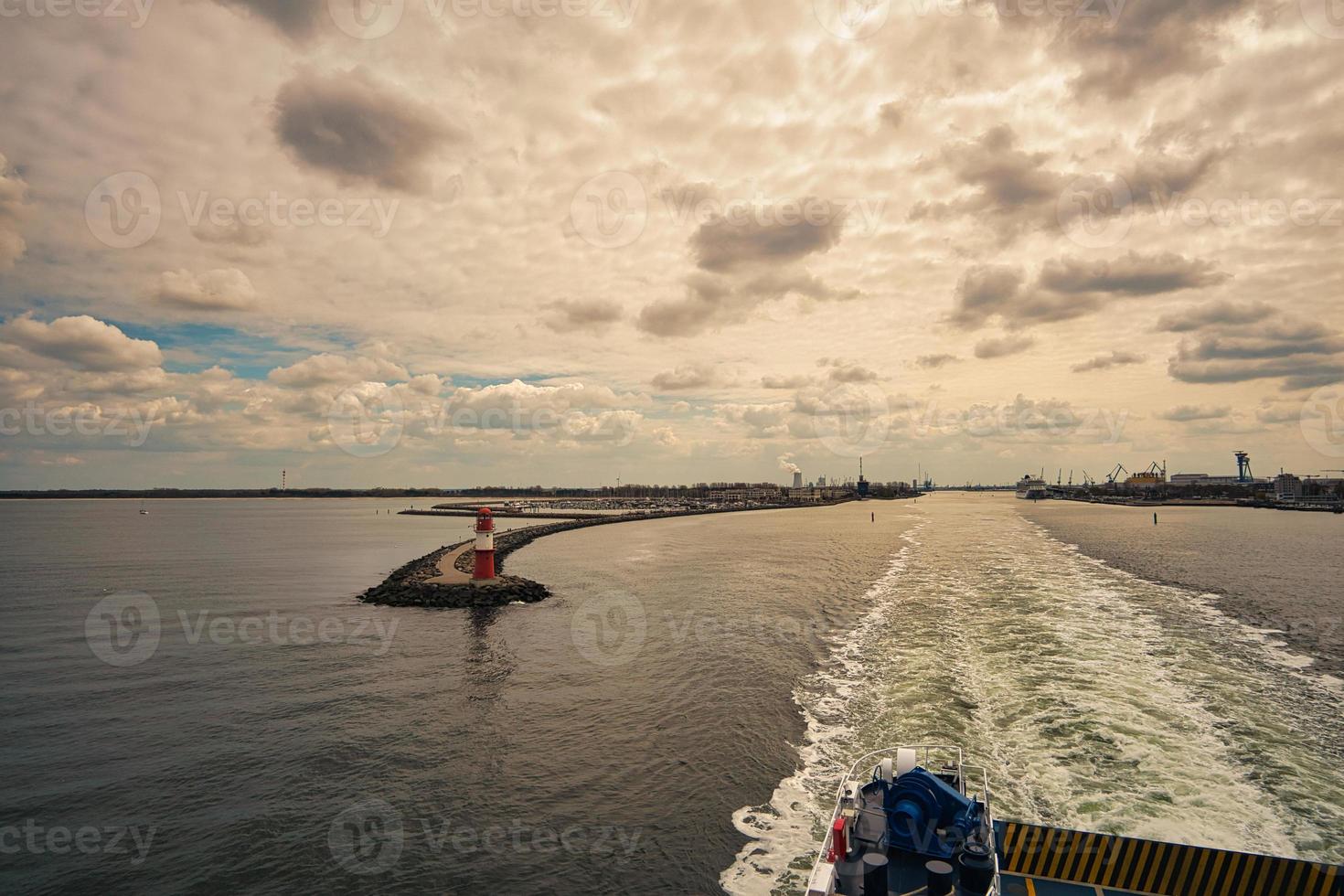 Lighthouse at Rostock harbor during departure by ship to Scandinavia. Baltic Sea photo