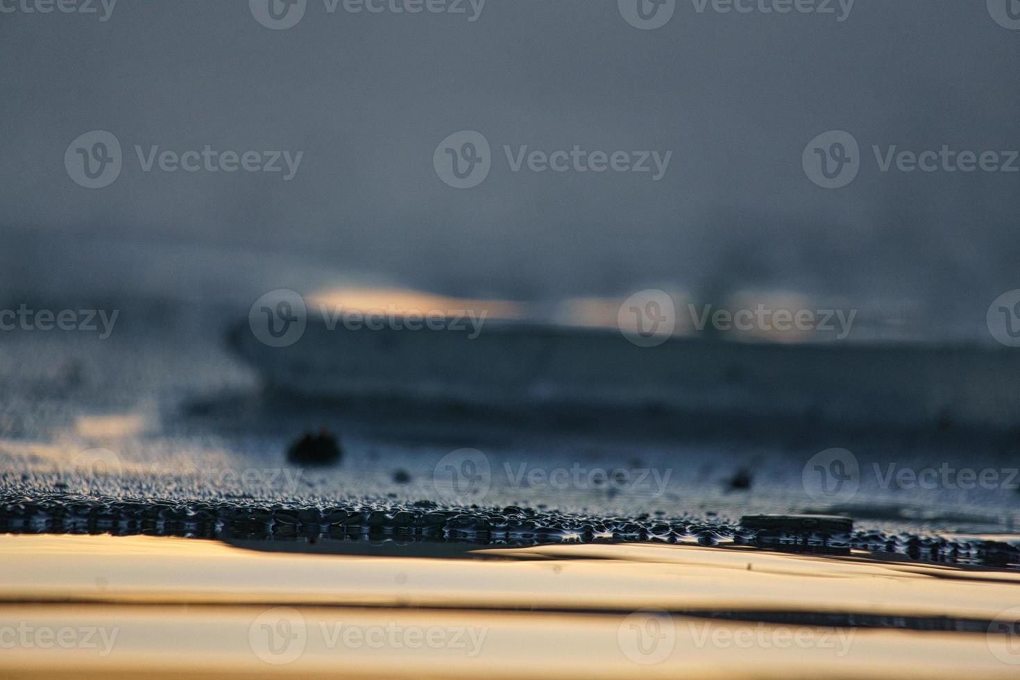 Ice edge on a lake at sunset. photo