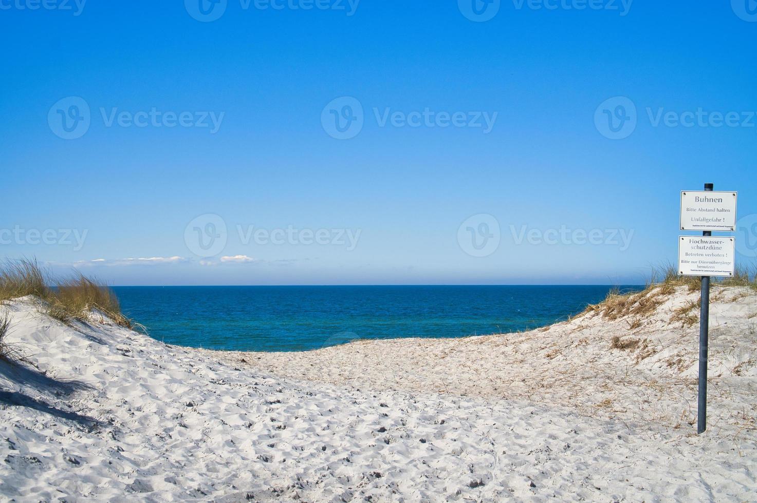 sunset on the baltic coast with clouds in the sky. in addition, the sound of the sea photo