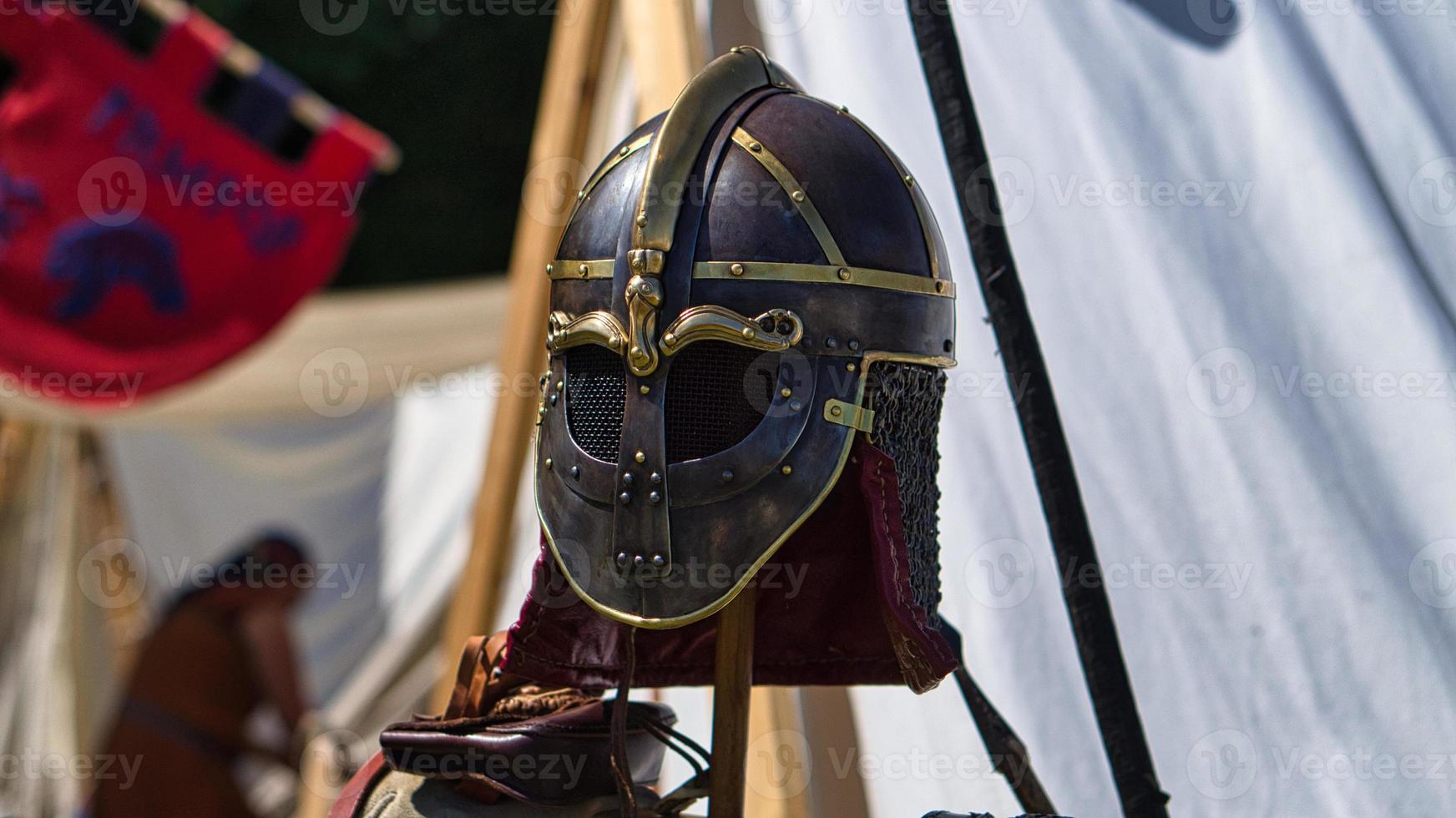 Medieval equipment, helmet, metal glove, armor. Medieval spectacle in times gone by photo