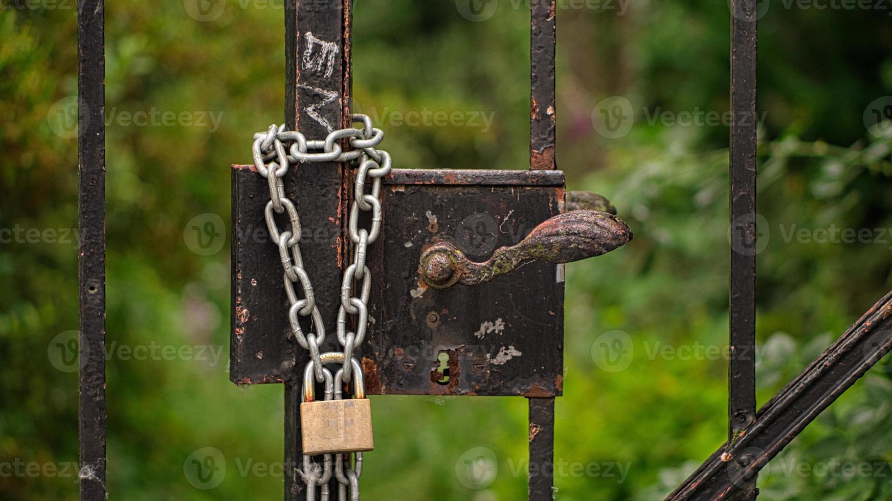 double holds better. Padlock that secures a locked door. photo