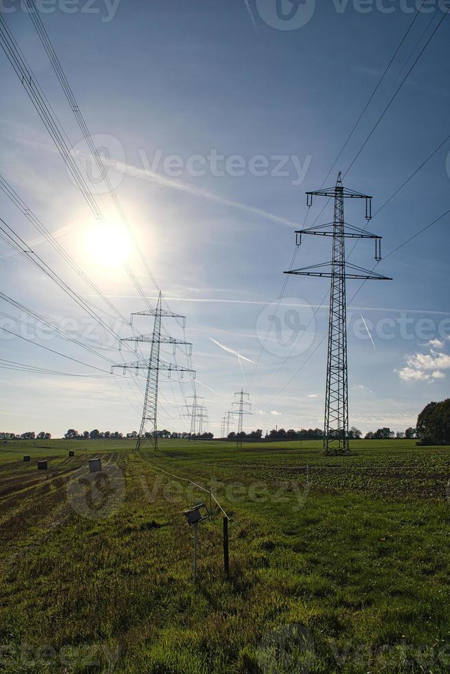 High voltage overhead power lines distributed across the country photo