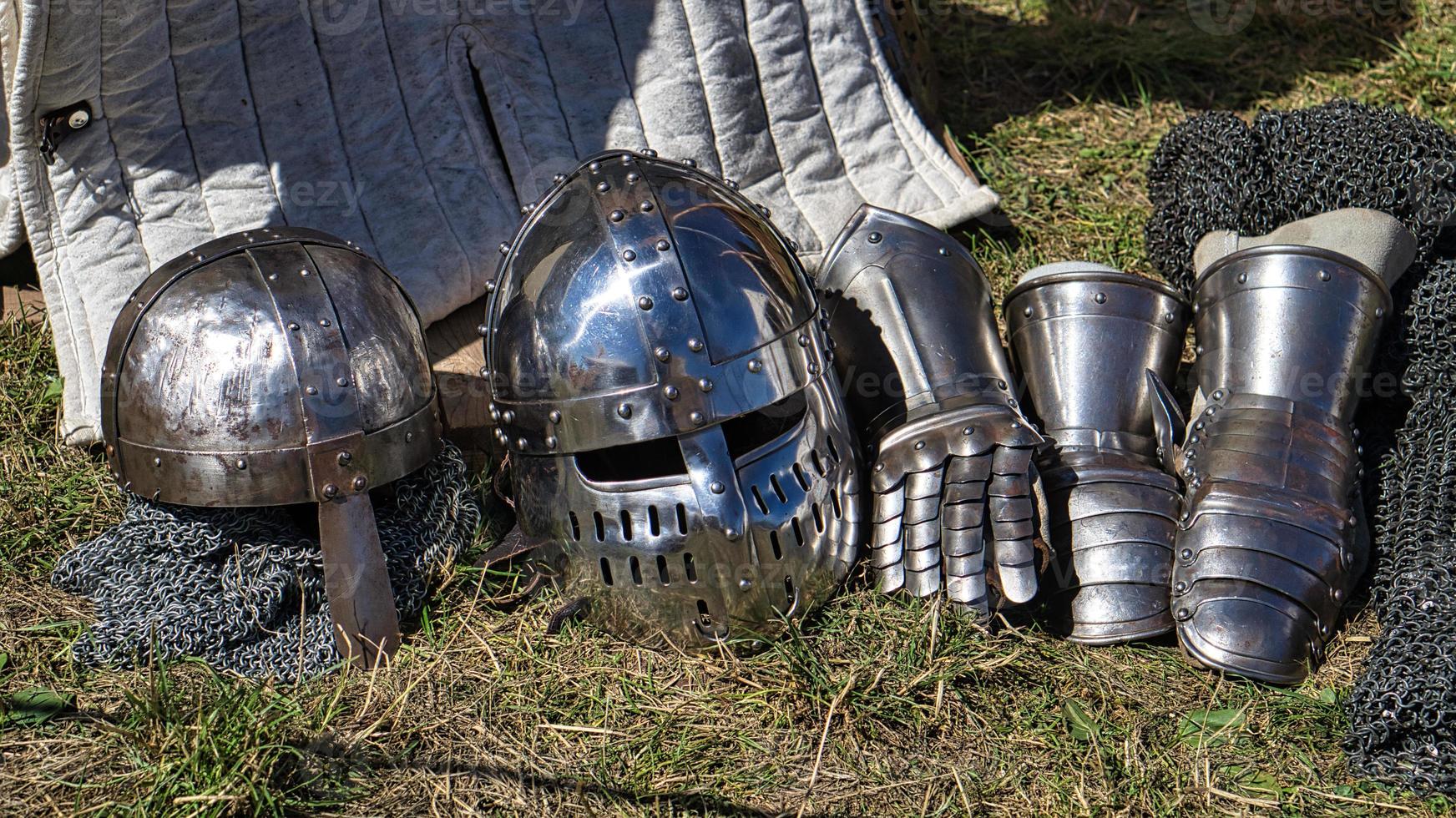 Medieval equipment, helmet, metal glove, armor. Medieval spectacle in times gone by. photo