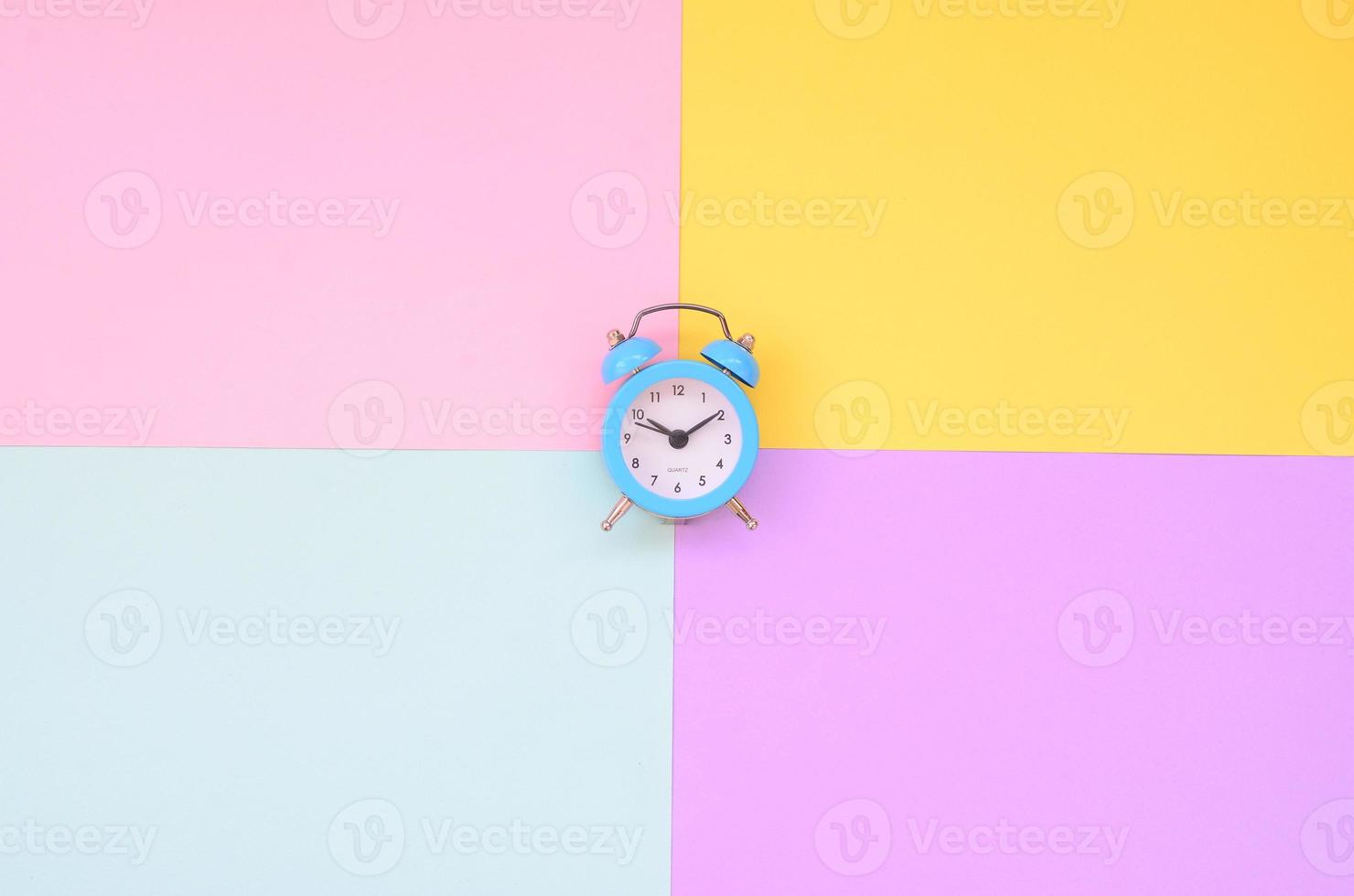 Time to choose metaphor concept. Alarm clock at the crossroads of different colors photo