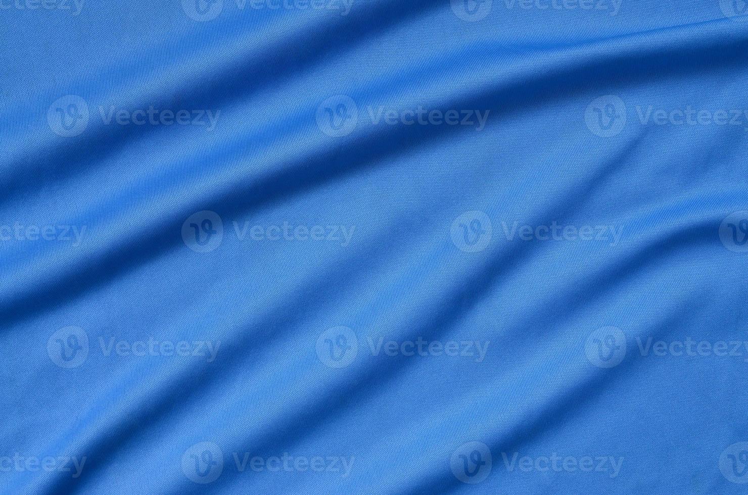 Detailed polyester blue fabric texture with many folds photo