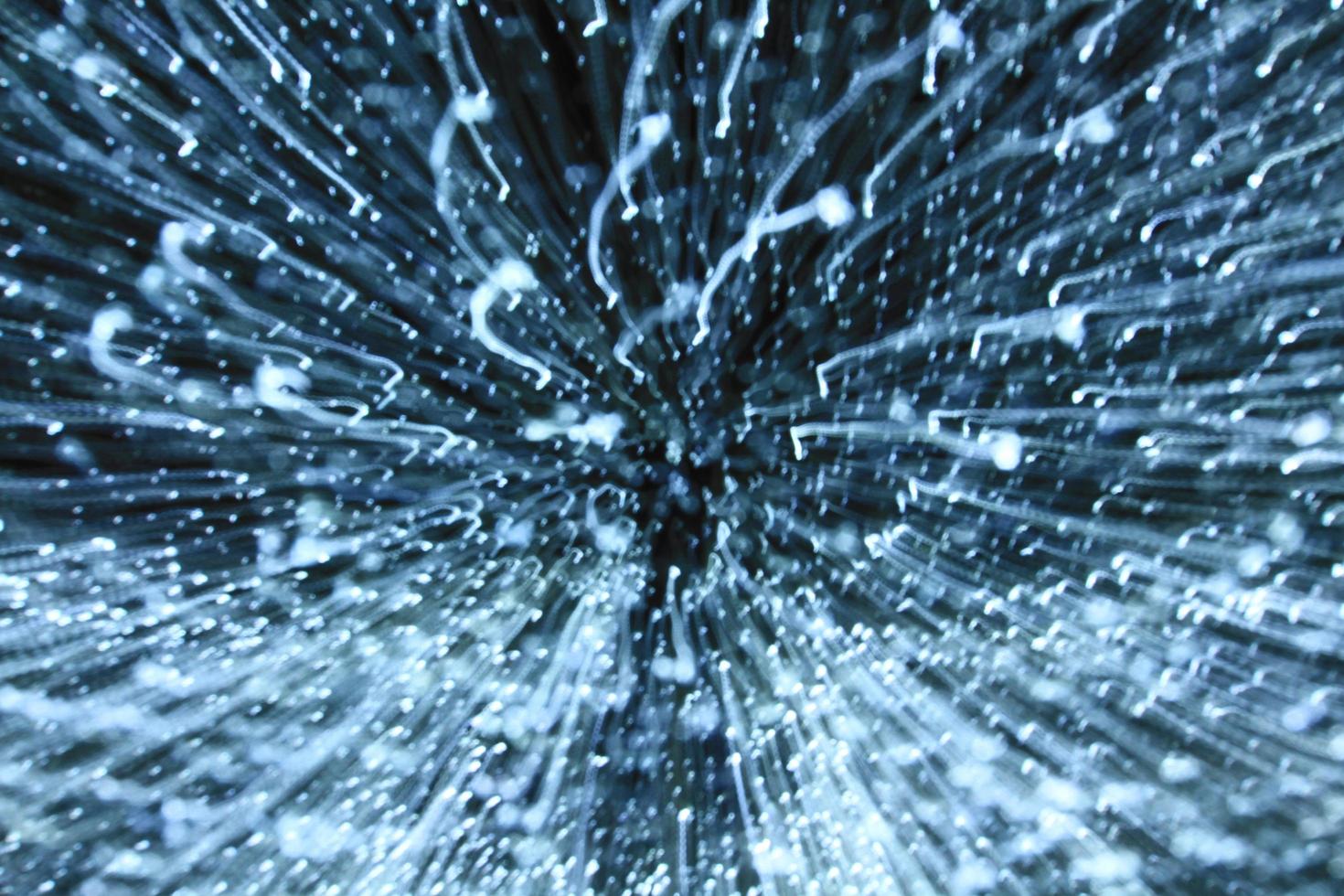 Blurred blue light background. Abstract art of lighting blur wallpaper at festival. Defocus, zooming and out of focus technique. photo