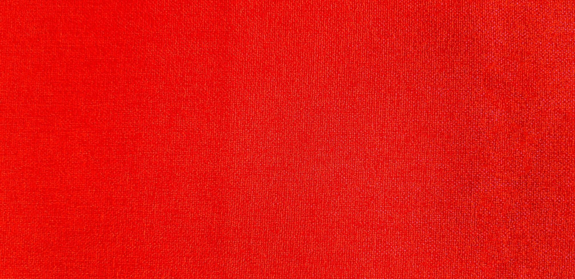 Textured of red sofa surface for background or wallpaper. Soft material and Pattern concept photo