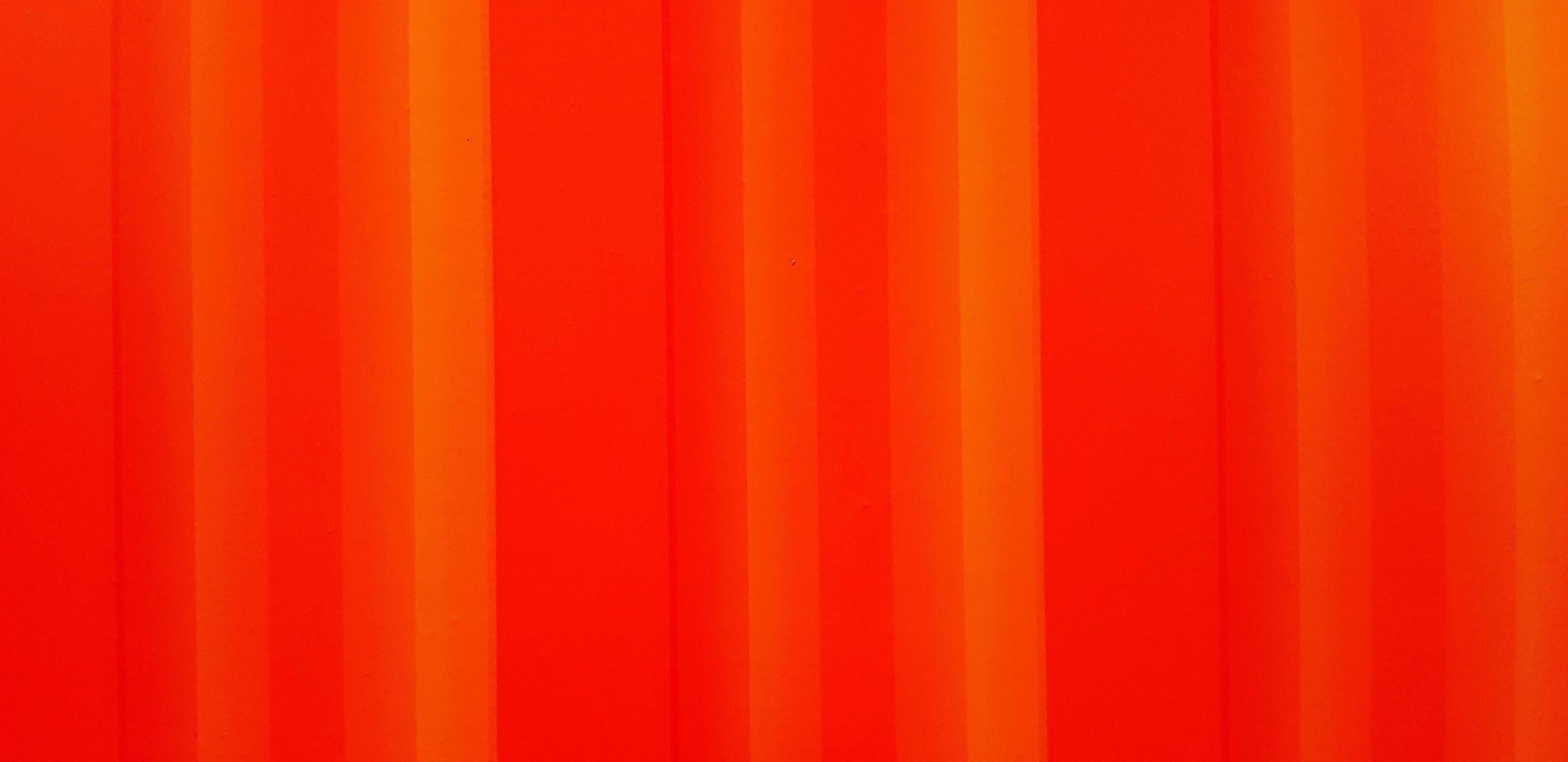 Line pattern of an orange background. Red wallpaper or wall. photo
