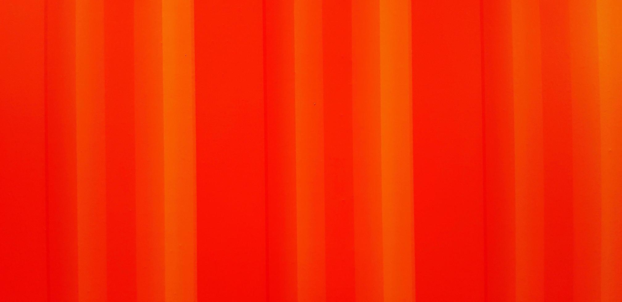 Line pattern of an orange background. Red wallpaper or wall. photo