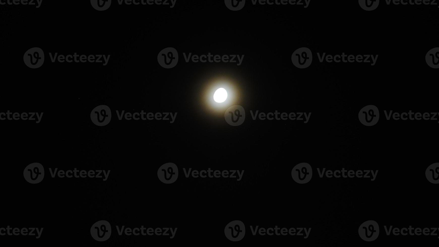 white moon in black night sky photo