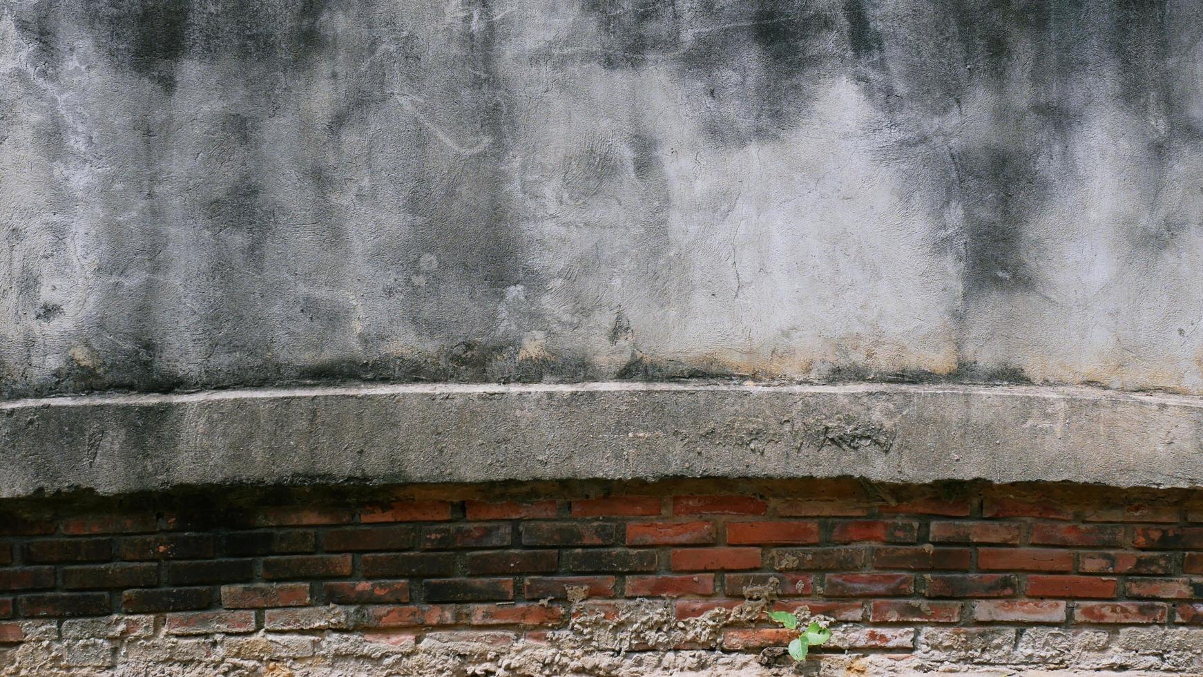 The old cement wall was weathered, the surface was scratched, the surface was scratched and damaged. For a mysterious retro-conservative background. photo