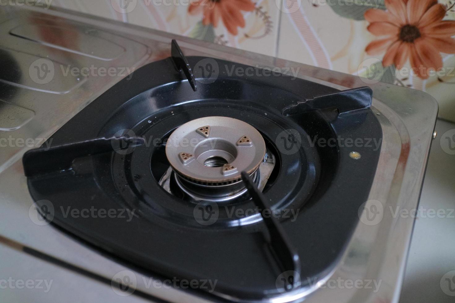 black square placemats on the gas stove 9744707 Stock Photo at Vecteezy