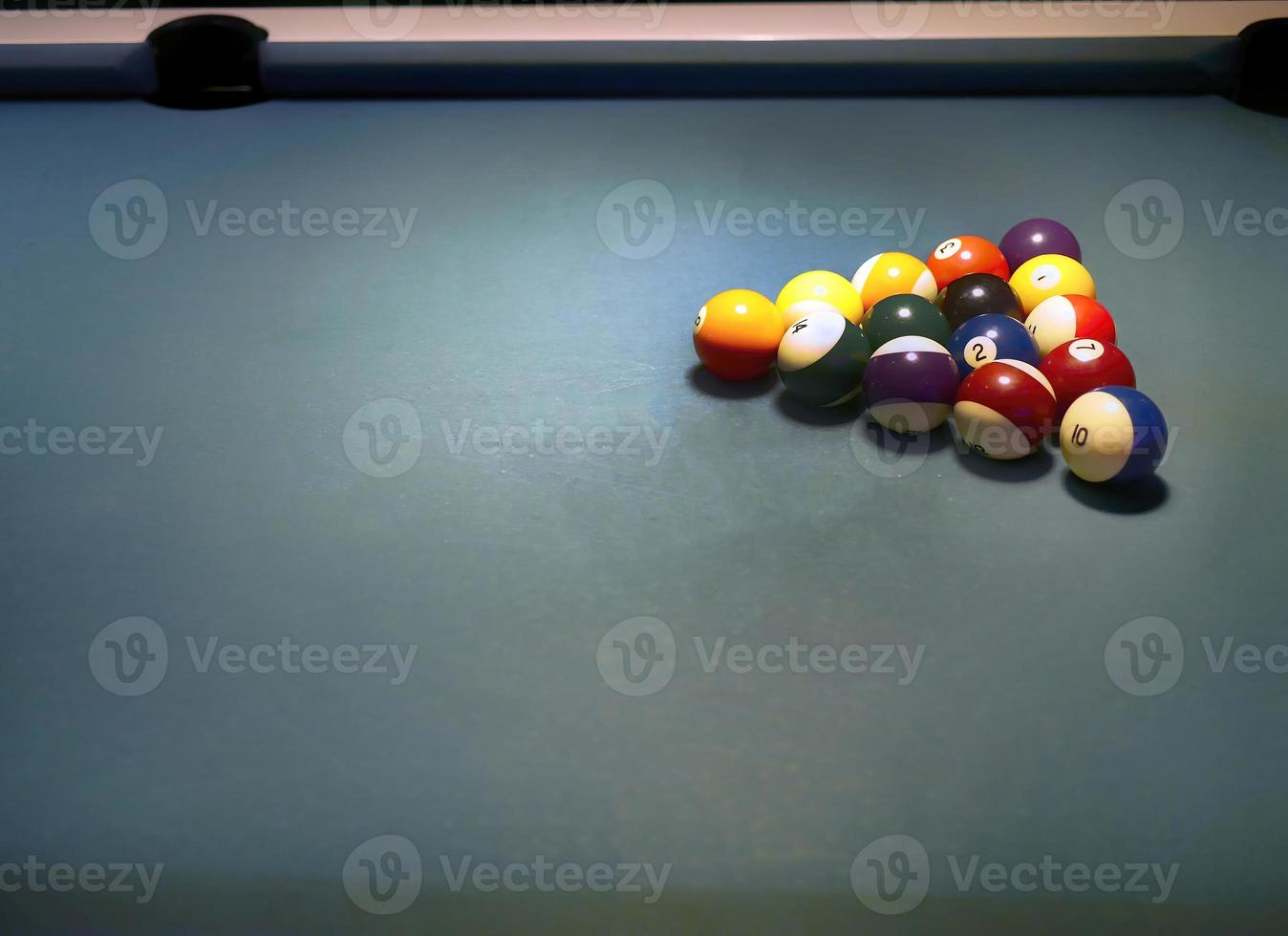 Close up of pool billiards balls on  pool table with setup position and copy space. photo