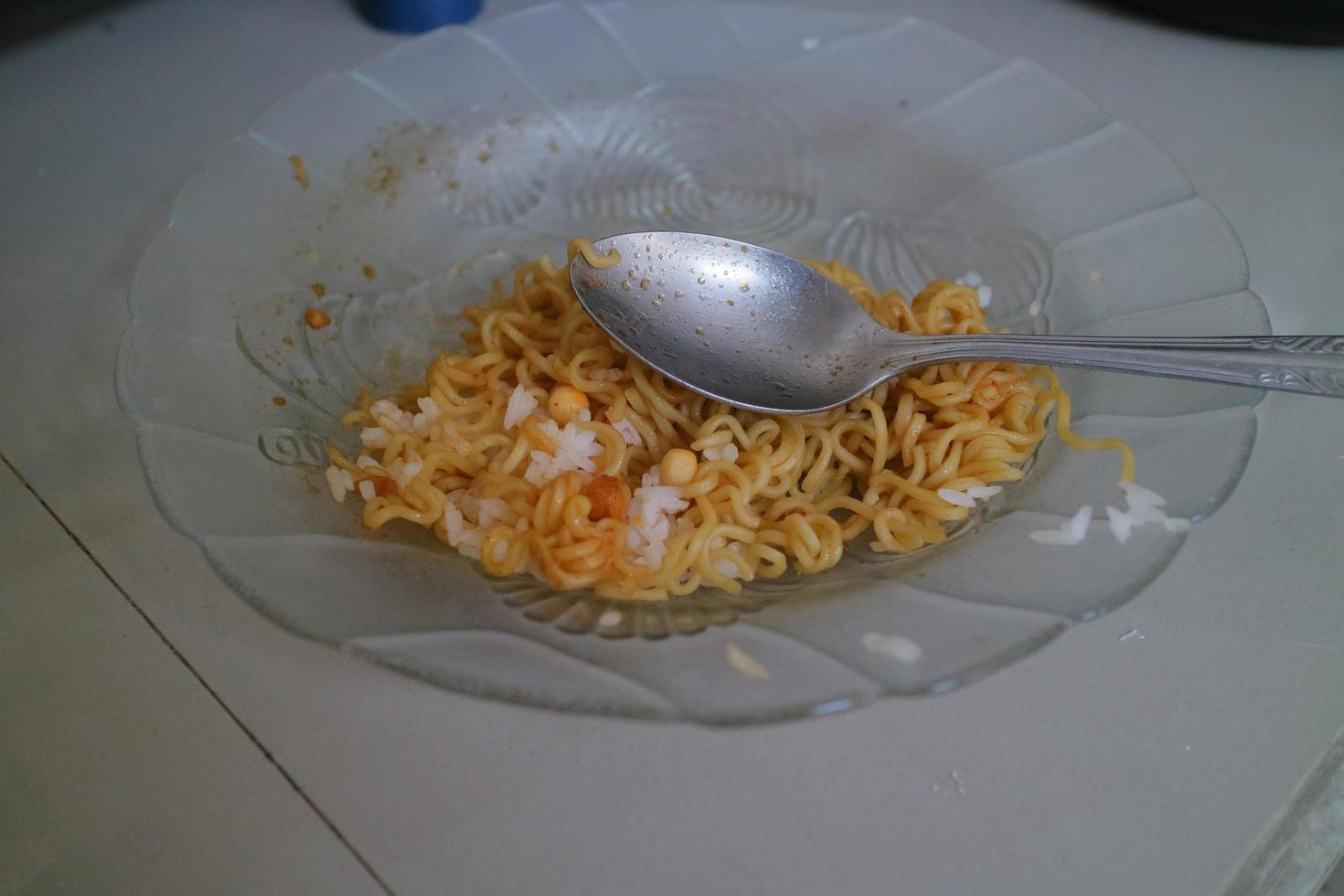 brown curly noodles on a clear glass plate photo