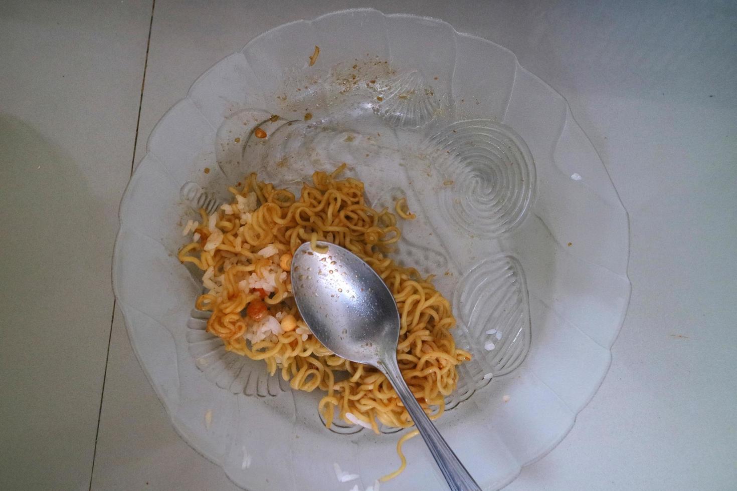 brown curly noodles on a clear glass plate photo