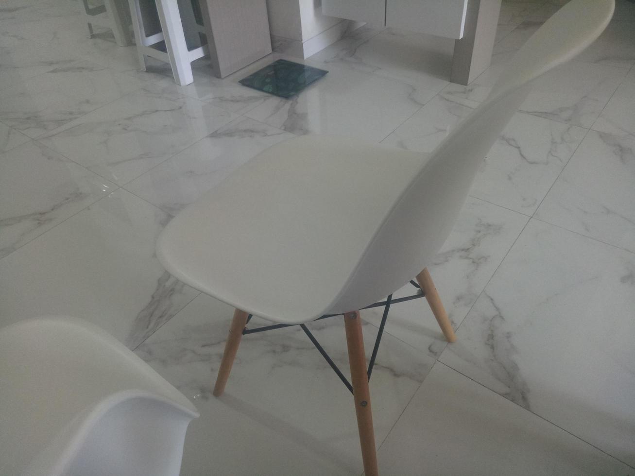 modern white chair on marble floor photo