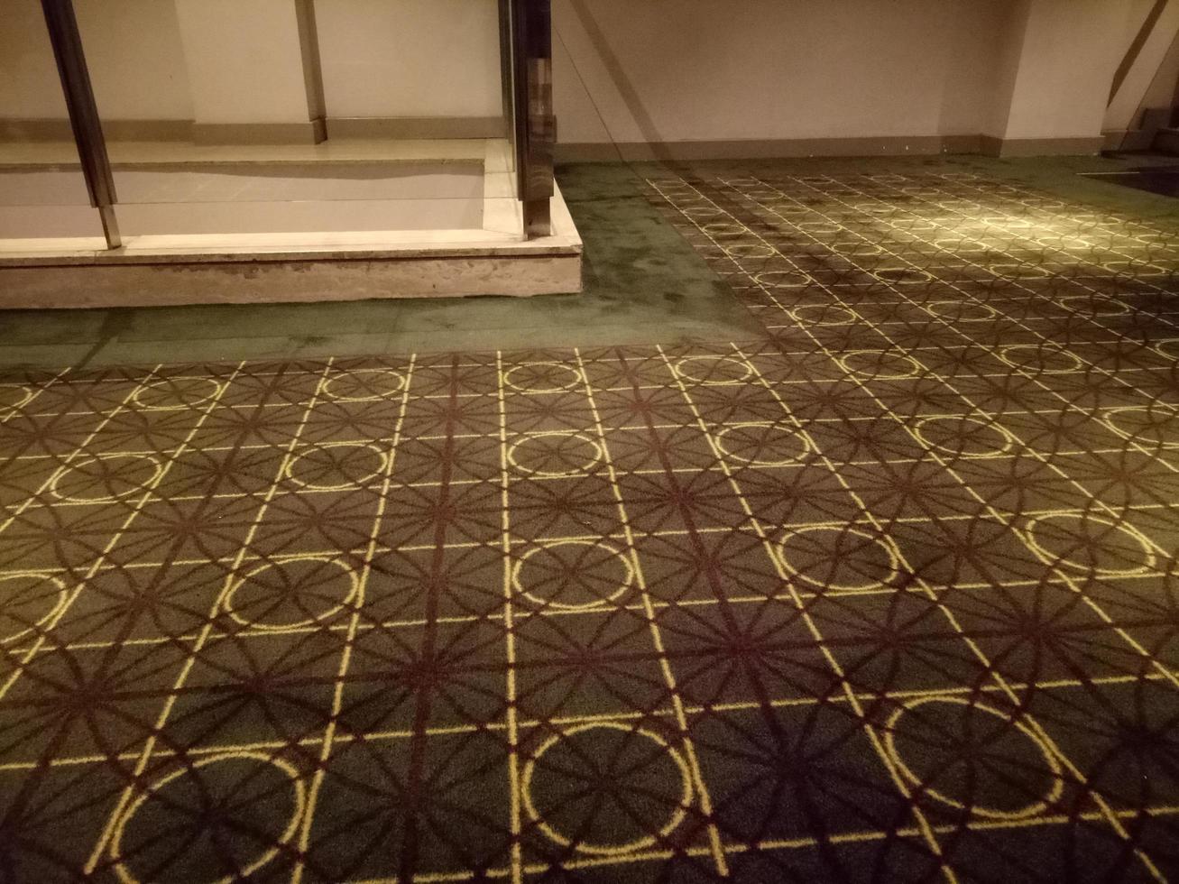 dark brown carpet with circle and square motif in the room photo