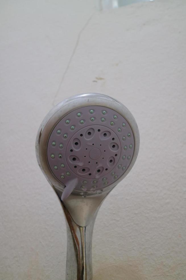 The end of the shower head is rounded for bathing photo