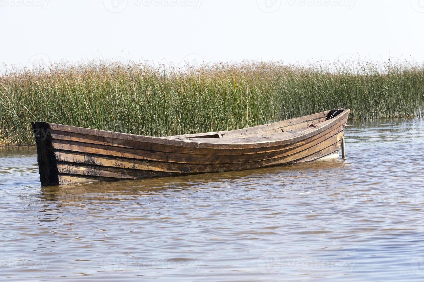 floating wooden boat photo