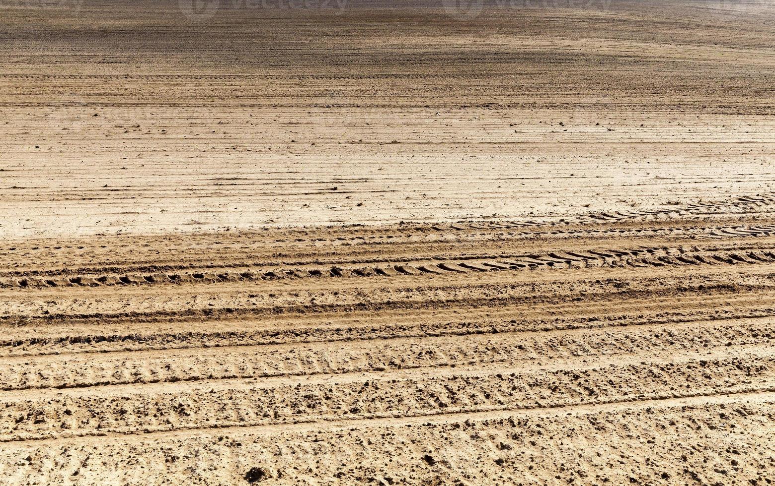 brown plowed  soil photo