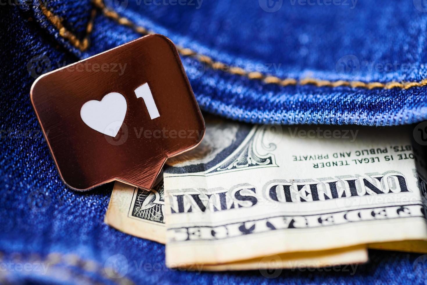 Like heart symbol and dollar in jeans pocket photo
