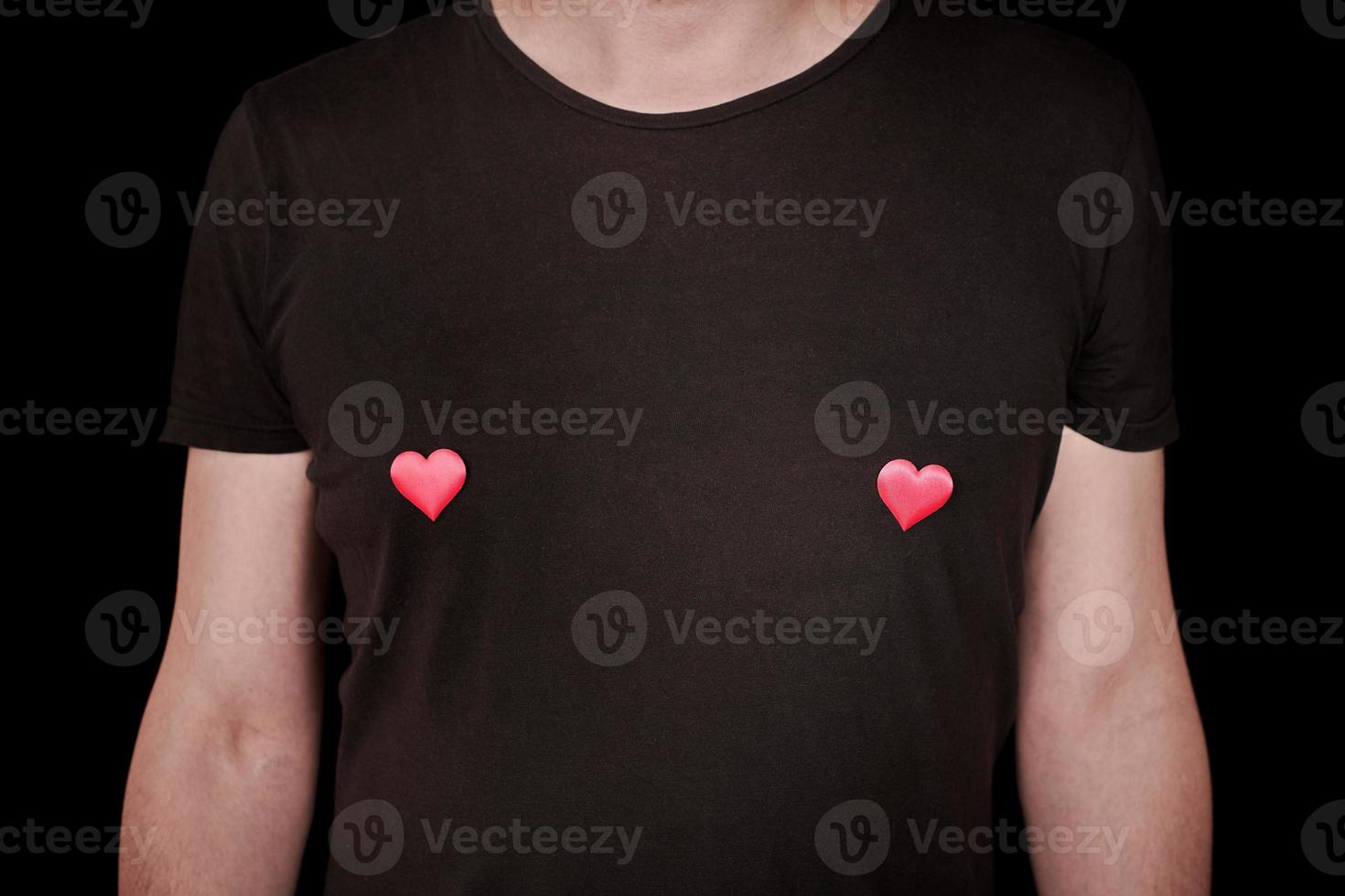 Two hearts on mans t-shirt. Funny love concept. photo