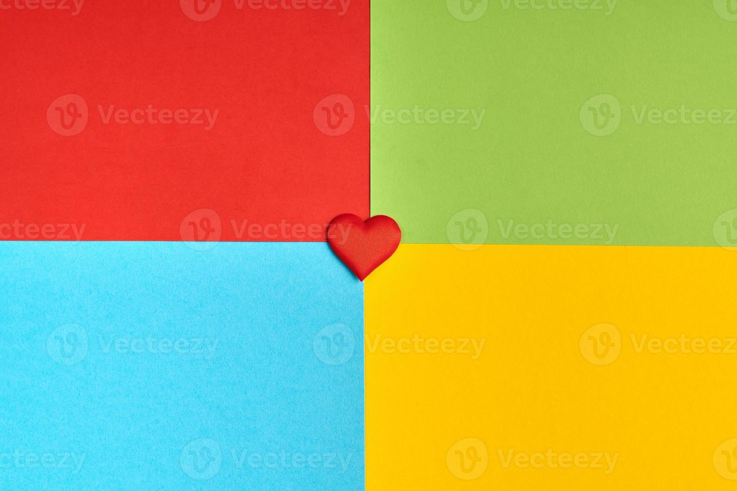 Red, green, blue, yellow paper colours. Corporation logo concept. photo