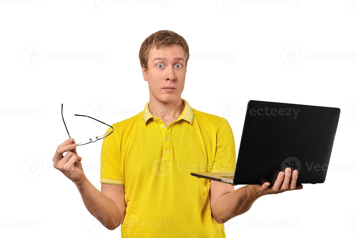 Puzzled male with notebook and glasses in hands isolated on white background, funny puzzled look photo