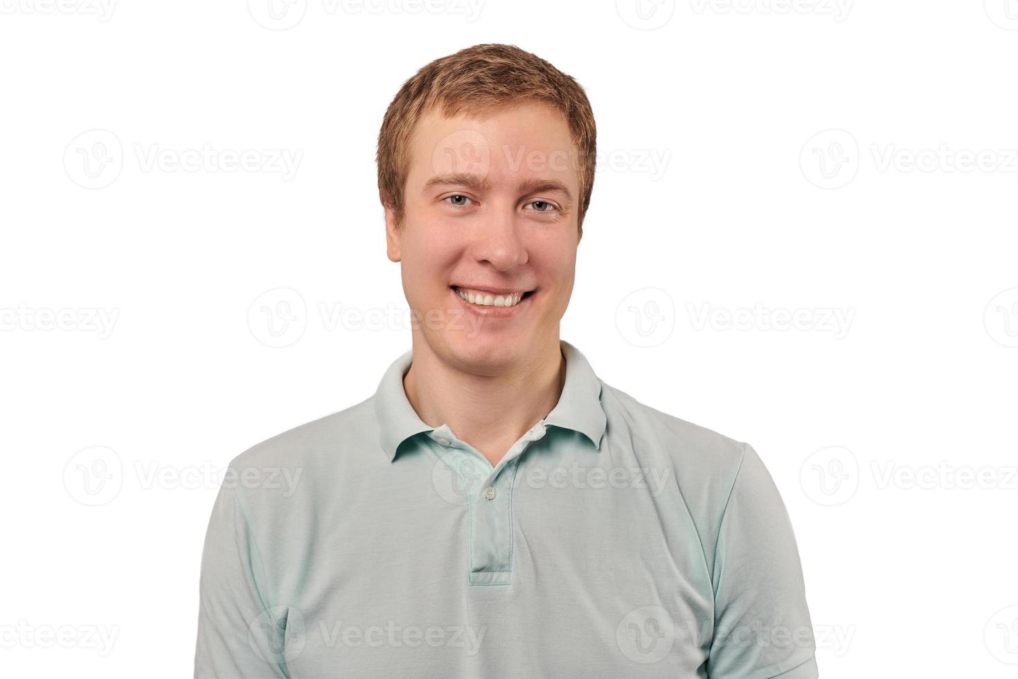 Portrait of funny young man in mint Polo T-shirt isolated on white background, handsome happy man photo