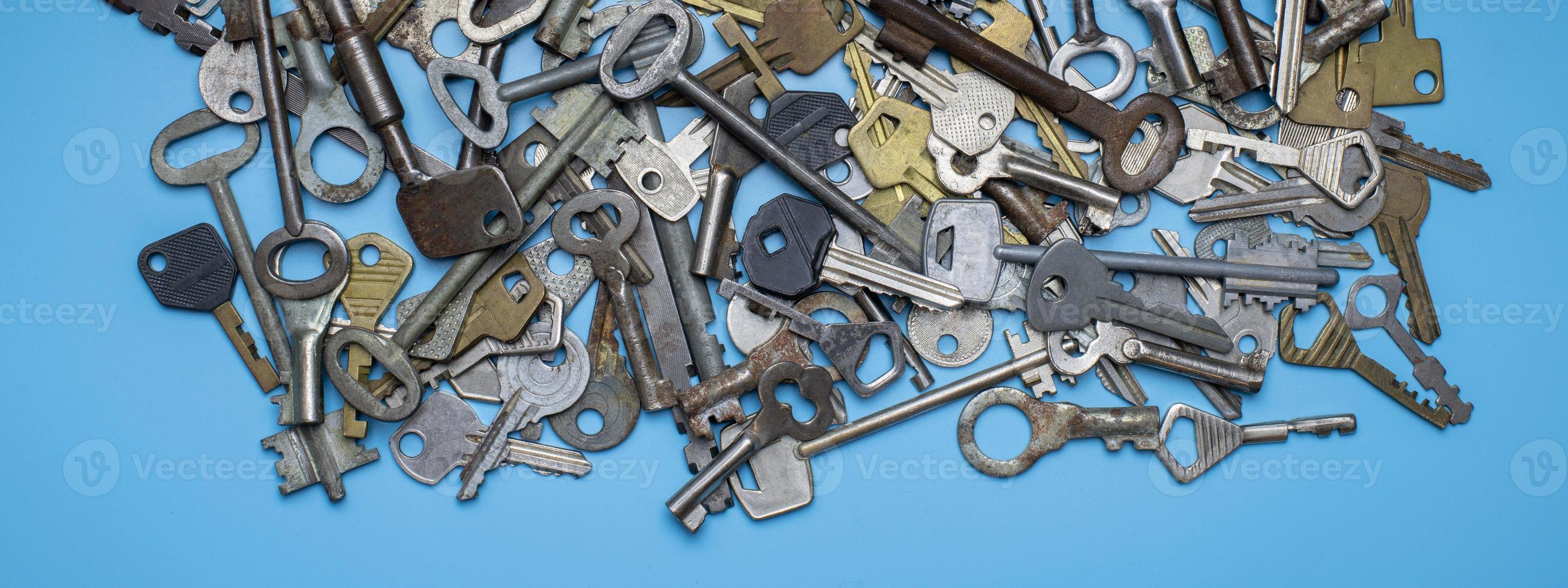 Keys set on blue background. Door lock keys and safes for property security and house protection