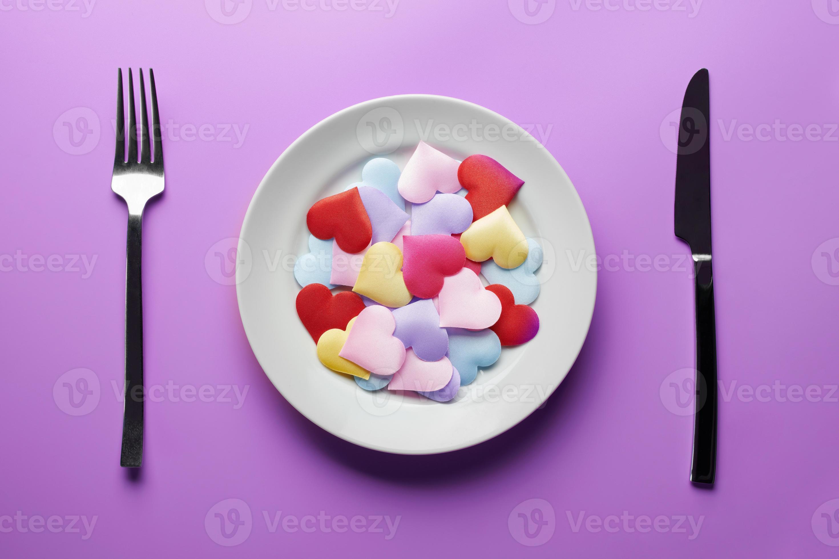 Love hearts in plate. Sex flirt concept. Fall in love in different partners. Pick a new girlfriend or boyfriend photo