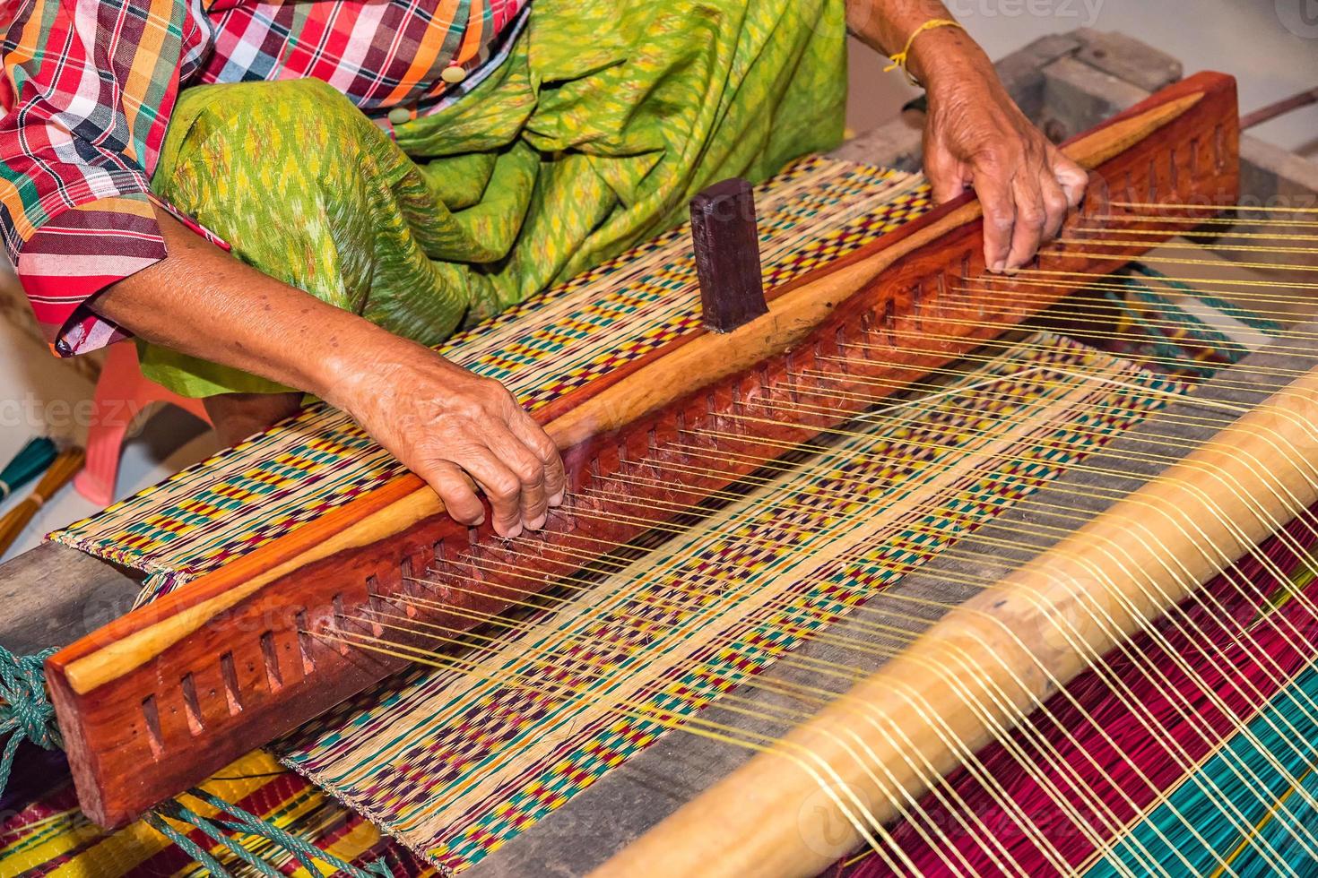 Weaving mats from dry reed 9756510 Stock Photo at Vecteezy