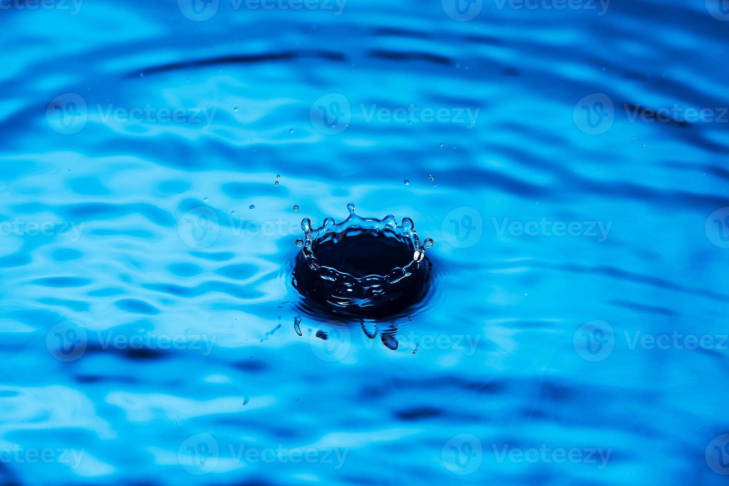 Water drop falling down. photo